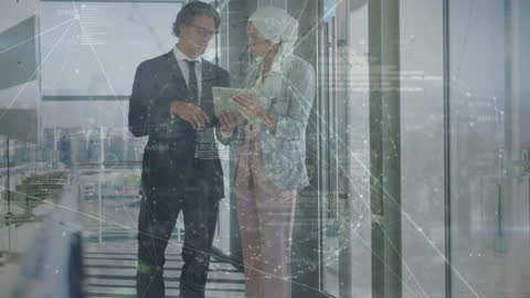 Coworkers Analyzing Digital Projection in Corporate Office