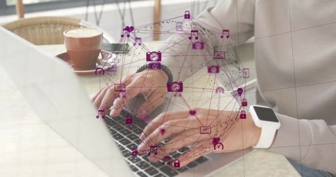 Person Engaging in Digital Communication on Laptop at Cafe