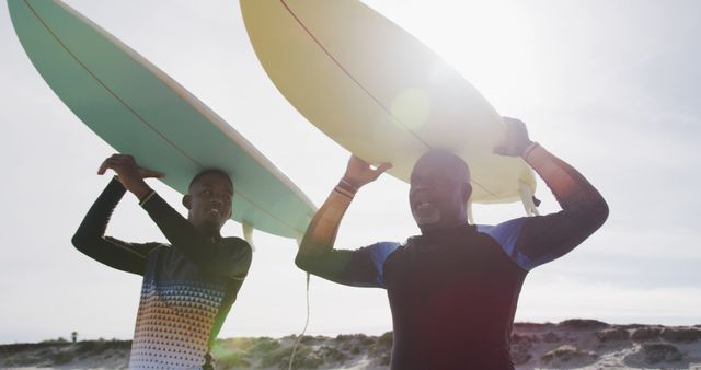 Father and Son Carrying Surfboards on Sunny Beach - Download Free Stock Images Pikwizard.com