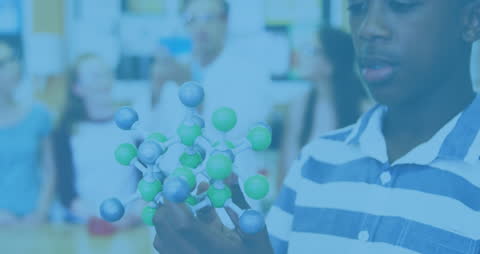 Student Analyzing Molecular Model in Science Classroom