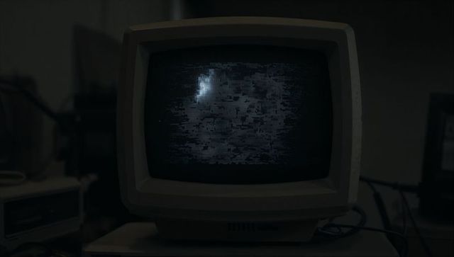 Vintage crt monitor with static screen in retro basement