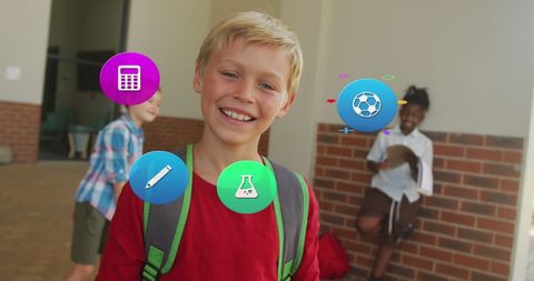 Smiling Schoolboy Wearing Backpack in Corridor with Education Icons