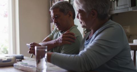 Senior Couple Having Online Medical Consultation Together at Home