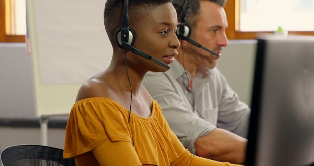 Customer Service Representatives Working at Desk with Headsets - Download Free Stock Images Pikwizard.com