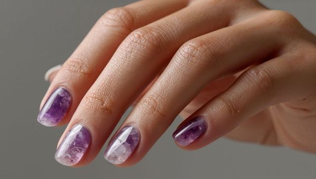 Showcasing glossy marble purple-white manicure on woman's hand, amethyst nail art detail