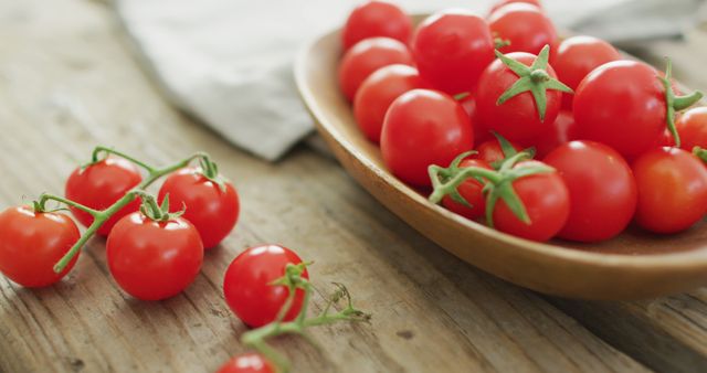 Image of fresh cherry tomatoes in bowl over wooden background - Download Free Stock Photos Pikwizard.com