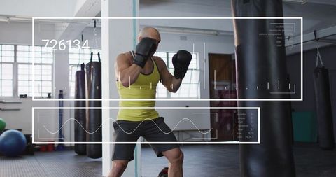 Boxer training with heavy bag in industrial gym with digital hud fitness overlay