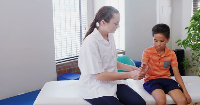 Pediatric Physiotherapist Treating Child's Arm in Clinic - Download Free Stock Images Pikwizard.com