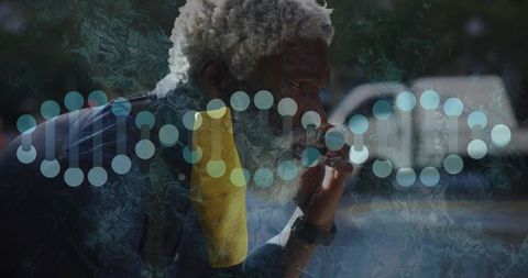 Elderly Man Reflecting on Health by Window with DNA Helix Overlay
