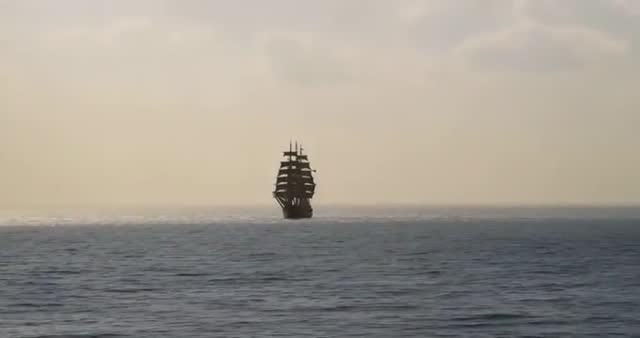 Sailing Ship Approaching in Hazy Open Sea Voyage