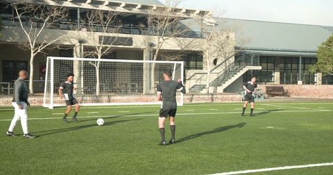 Team Soccer Practice in Outdoor Field on Sunny Day