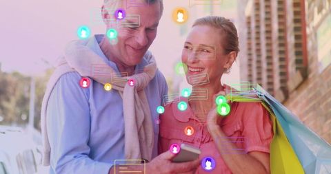 Senior Couple Enjoying Digital Social Interaction While Shopping