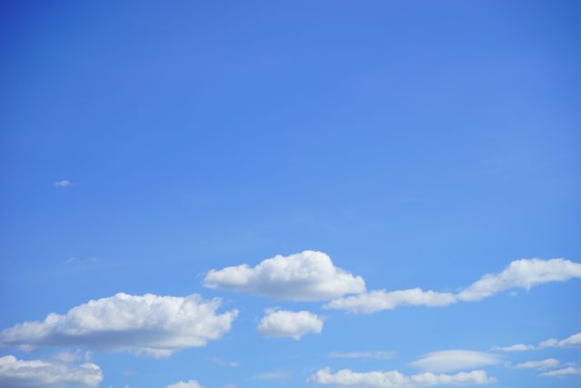 Bright Blue Sky with Minimal White Clouds in Daylight - Download Free Stock Photos Pikwizard.com