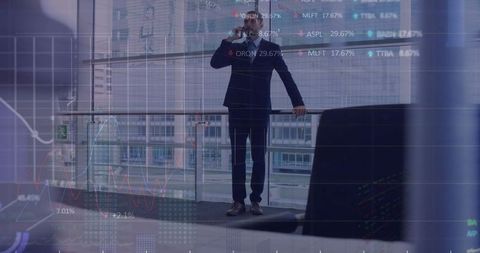 Businessman Analyzing Finance Data with Smartphone in Modern Office