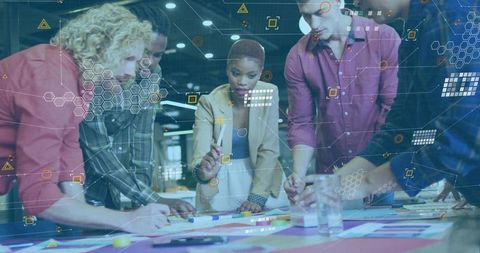 Diverse team brainstorming with modern technology overlay