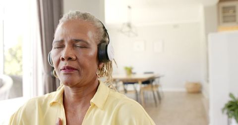 Seniors Enjoying Music with Headphones at Home