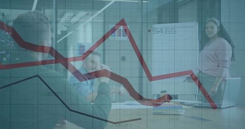 Woman presenting to team with falling financial chart overlay in modern conference room