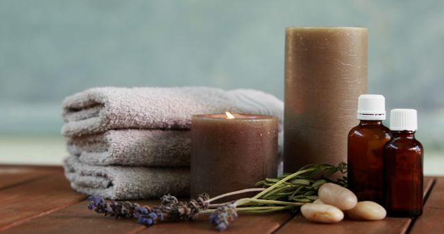 Towels candles and dried lavender by the pool at the spa