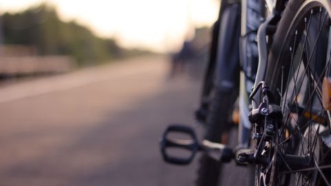 Close-up of bicycle on empty rural road