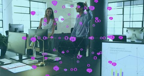 Team collaborating around ai data visualization in open office with monitors and charts