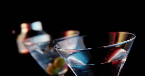 Falling confetti over vibrant cocktails celebrating cocktail day