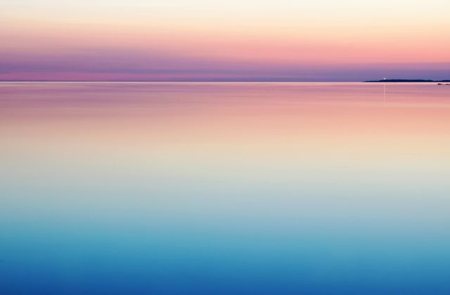 Serene Sunset Over Calm Waters with Gradient Colors - Download Free Stock Photos Pikwizard.com