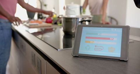 Tablet Displaying Energy Usage in Modern Kitchen Environment - Download Free Stock Images Pikwizard.com