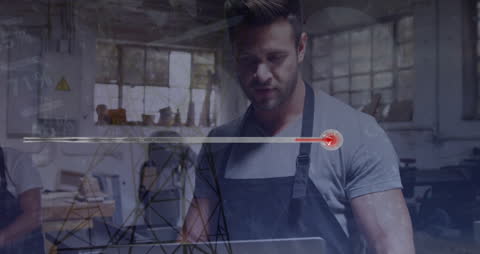 Workman Analyzing Energy Data in Industrial Setting