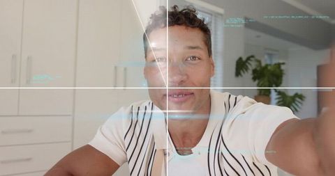 Man streaming vlog in modern kitchen with futuristic hud overlay and camera grid