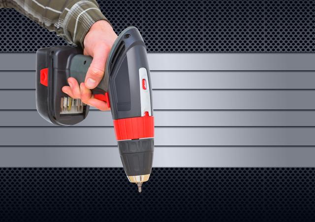 Person holds a cordless power drill against a metallic, industrial-themed background. Useful for topics related to construction, DIY projects, home improvement, and handyman skills. Ideal for websites, advertisements, blogs, and articles focused on tools, building materials, and repair work.
