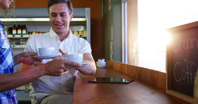 Barista Serving Coffee to Customer at Cozy Cafe Counter - Download Free Stock Images Pikwizard.com