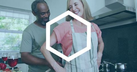 Midlife Couple Enjoying Cooking Together in Cozy Kitchen Setting