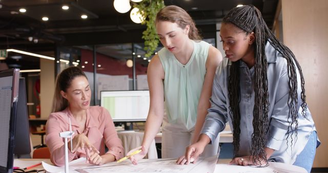 Three Female Engineers Collaborating on Project in Modern Office - Download Free Stock Images Pikwizard.com