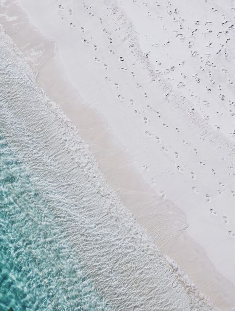 Aerial View of Tranquil Beach and Turquoise Ocean Waves Meeting White Sandy Shore - Download Free Stock Images Pikwizard.com