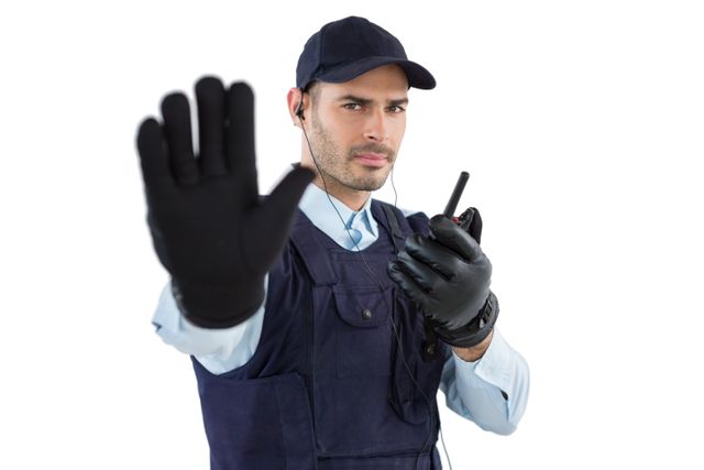 Confident security officer making stop gesture - Download Free Stock Photos Pikwizard.com
