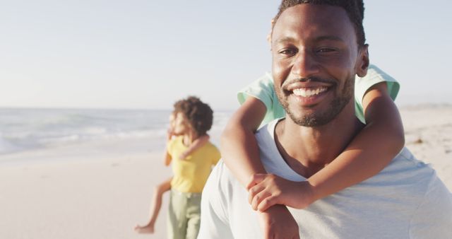 Happy family enjoying beach vacation at sunset - Download Free Stock Images Pikwizard.com