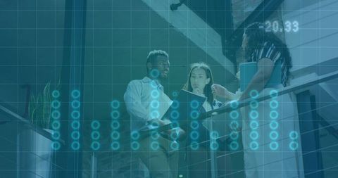 Business team reviewing analytics on mezzanine with blue digital dashboard overlay