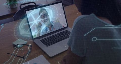Smiling Professional on Laptop During Remote Video Call with Futuristic Interface Overlay