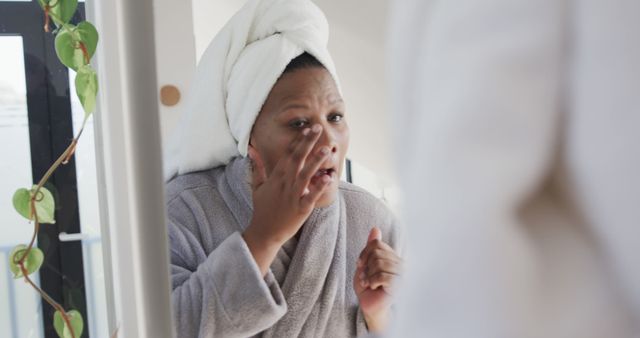 Woman Applying Skincare Cream In Bathroom Mirror - Download Free Stock Images Pikwizard.com