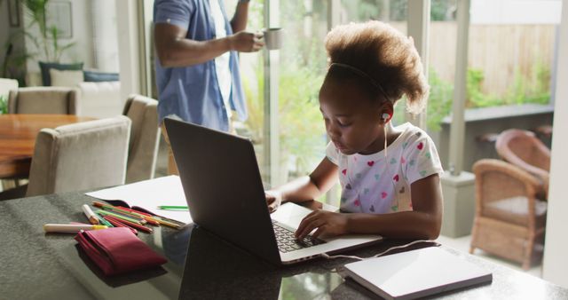 Young girl studying online at home using laptop enjoying virtual learning - Download Free Stock Images Pikwizard.com