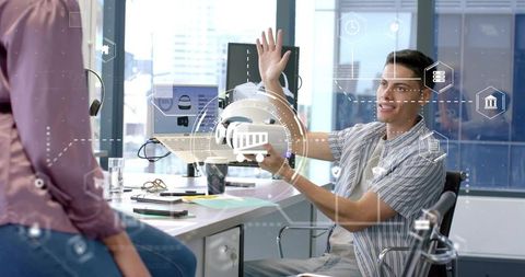 Young man presenting vr headset to colleague in modern office showcasing collaborative tech innovati