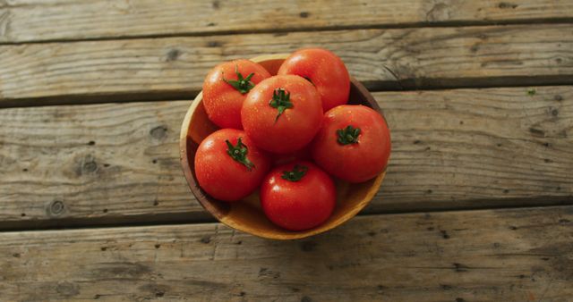 Image of fresh tomatoes in bowl over wooden background - Download Free Stock Photos Pikwizard.com