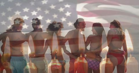 Friends embracing on beach at sunset with american flag and buoys double exposure