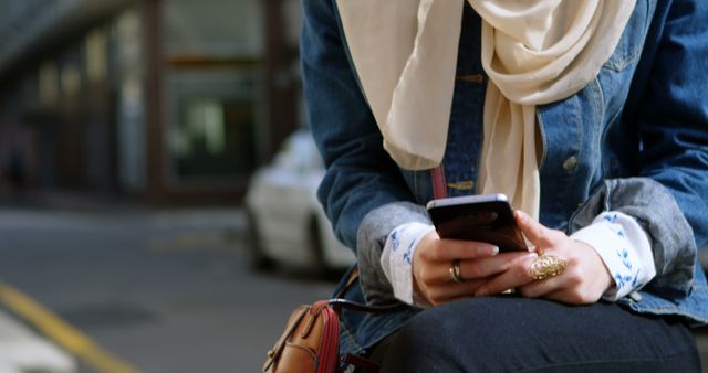 Young Woman Outdoors Engrossed in Smartphone Task - Download Free Stock Images Pikwizard.com