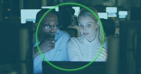 Collaborative Professionals Analyzing Data on Computer Screens