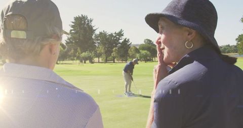 Senior Couple Watching Concurrent Golfer on Sunny Golf Course - Download Free Stock Images Pikwizard.com