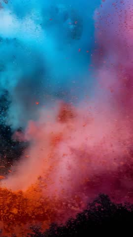 Exploding orange plume merging with cyan and magenta clouds in vertical colorburst video