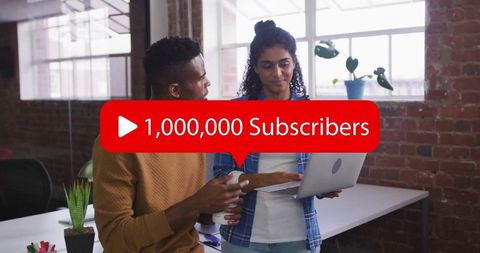 Coworkers celebrating 1 million subscribers milestone in modern office