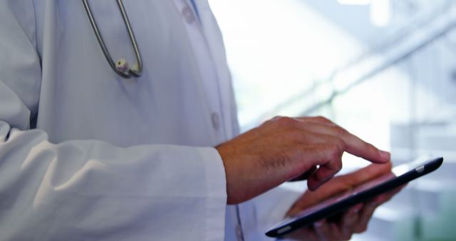 Doctor Using Digital Tablet for Patient Records Management - Download Free Stock Images Pikwizard.com