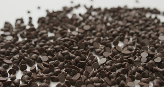 Pile of Dark Chocolate Chips on a White Background - Download Free Stock Images Pikwizard.com